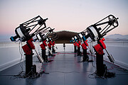 The MEarth-South telescope array, located on Cerro Tololo in Chile, searches for planets          by monitoring the brightness of nearby, small stars.