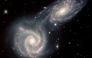 Siamese Twin Galaxies in a Gravitational Embrace
